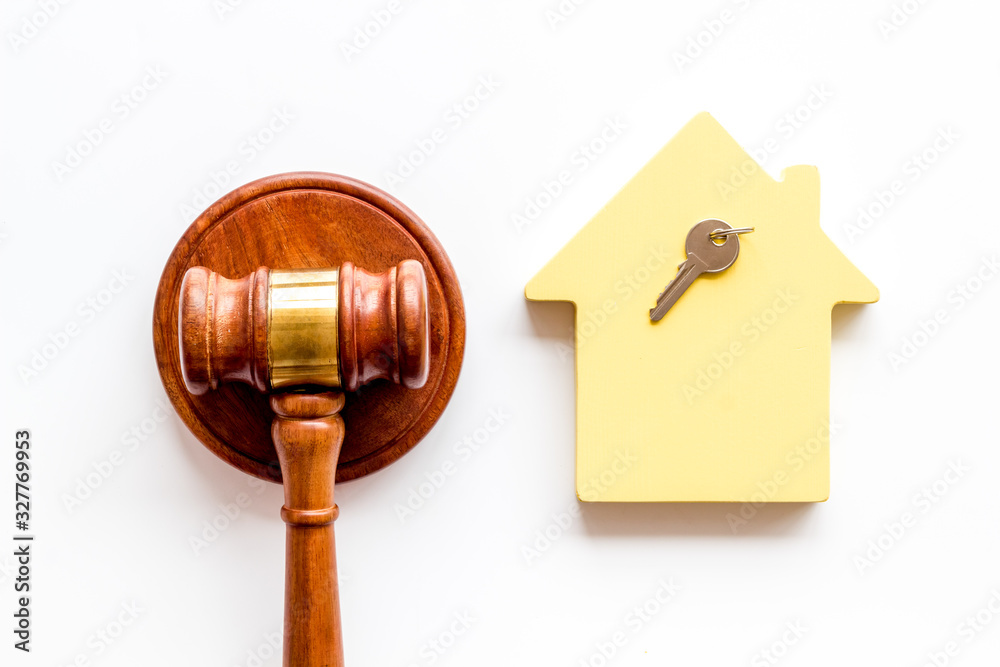 Property auction. Judge gavel near house on white background top-down Property auction. Judge gavel near house on white background top-down