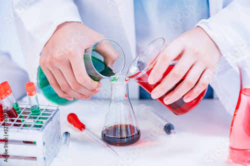 Asian scientist working in science and chemical for health. Doctor with Virus in lap test to protect infectious disease. photo