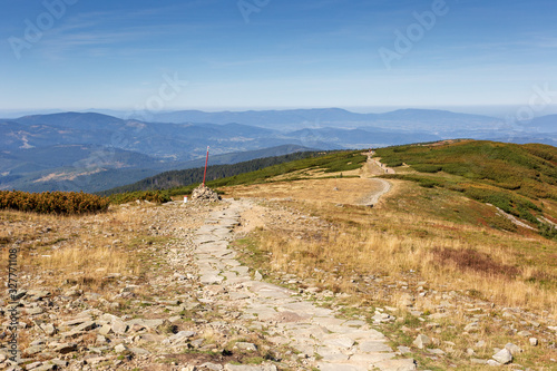 Fototapeta Naklejka Na Ścianę i Meble -  Hiking path to Babia Gora Mountain in Poland under blue sky in summer, polish Beskid Mountains landscape with path