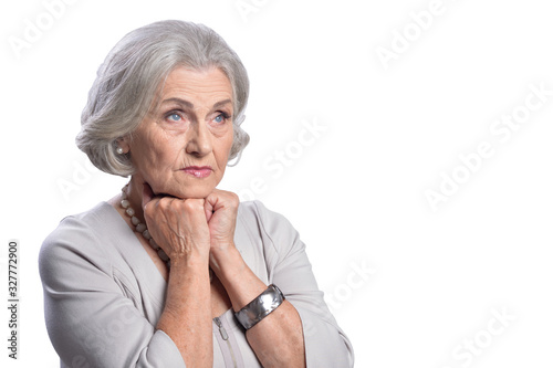 Sad senior woman posing isolated on white background