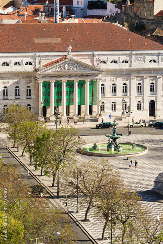 view to the Rossio Square, with Theater D. Maria II in the background surrounded by typical architecture in Lisbon, Portugal photo