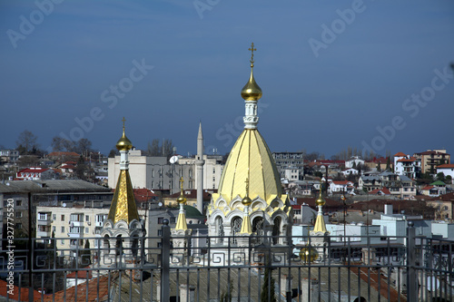view of the temple and mosque in the city among the houses