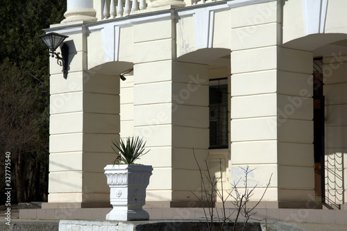 Entrance to an old building with large square stone columns