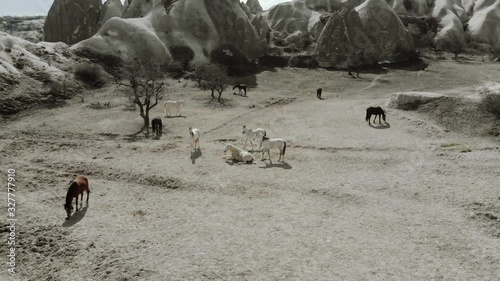 Aerial Drone Shot footage travelling and flying between fairy chimneys through valleys in Cappadocia Kapadoya Nevsehir Turkey photo