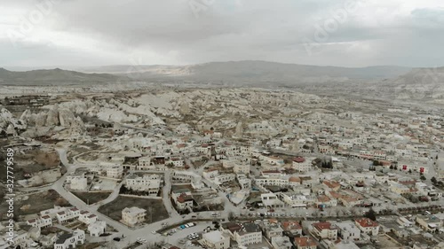 Aerial Drone Shot footage travelling and flying between fairy chimneys through valleys in Cappadocia Kapadoya Nevsehir Turkey photo