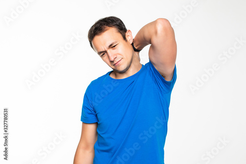 Young fitness man fell ache in muscle after training isolated on white background