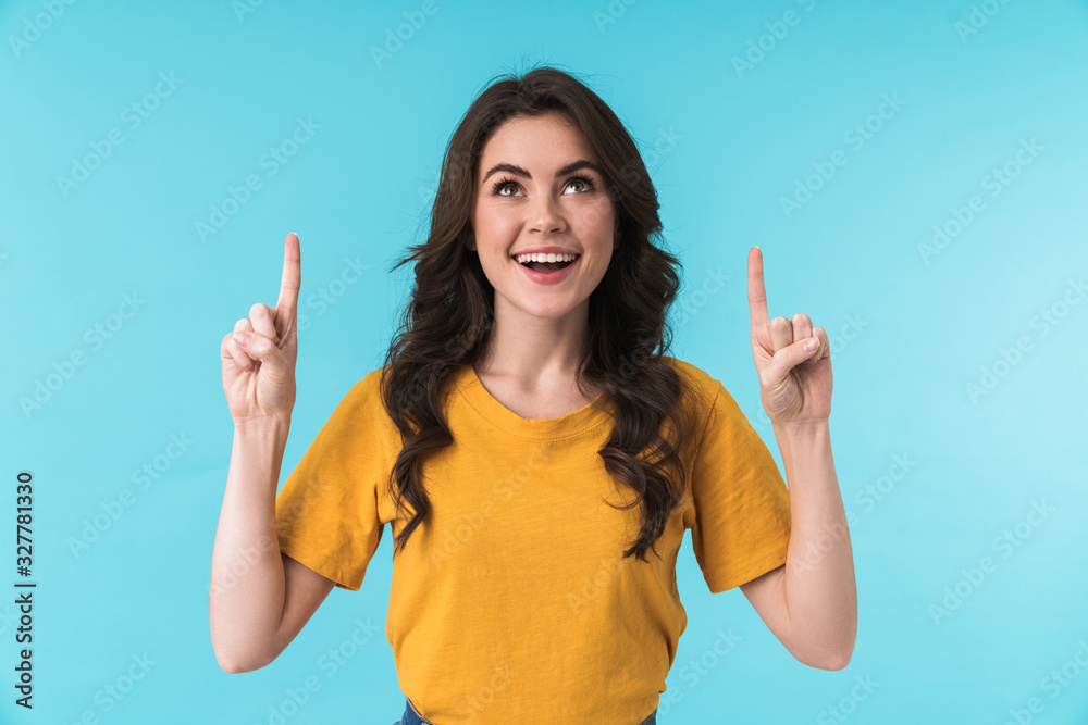 Positive young pretty woman pointing. Positive young pretty woman pointing.