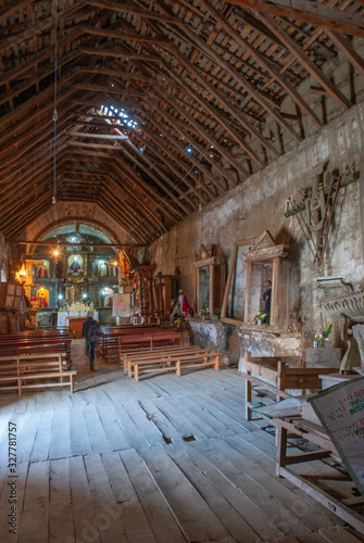 Interior of old church. Peru. Andes. Hu  nuco Region  Huamal  es Province  Tantamayo District. Wooden interior structure. Wooden beams.