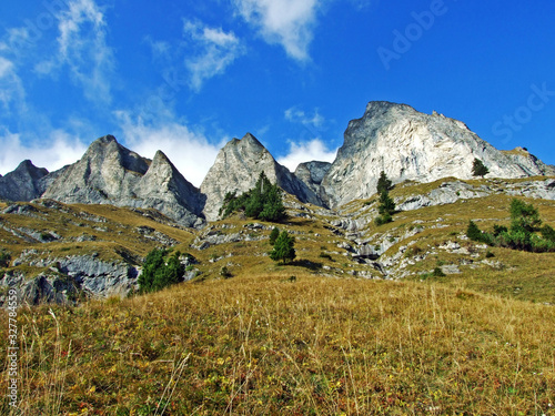 Steep picturesque rocks Falknistürm (Falknisturm or Falknistuerm) in the Ratikon border mountain massif or Rätikon Grenzmassiv, Mainfeld - Canton of Grisons (Graubünden or Graubuenden), Switzerland photo