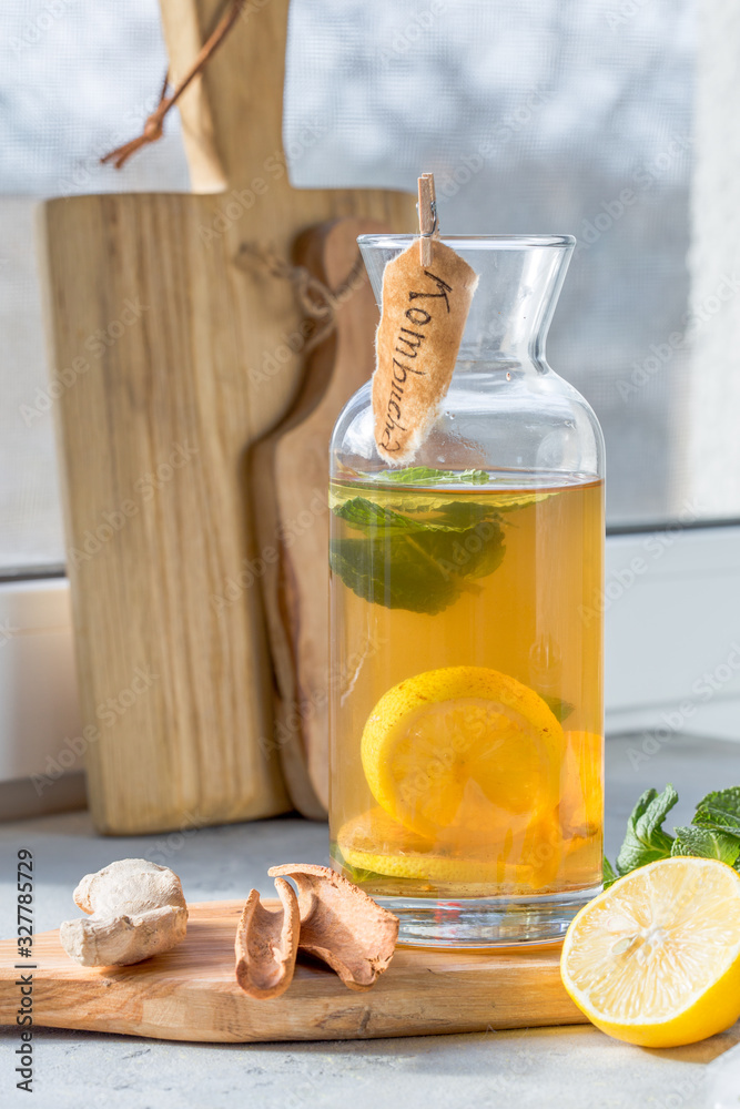 Fototapeta premium Kombucha or cider fermented drink in bottle. Heathy probiotic drink