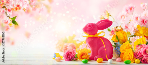 Easter decoration with Easter eggs, bunny and spring flowers on white wooden ...