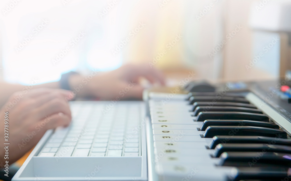 Fototapeta premium Close up hand making music by computer