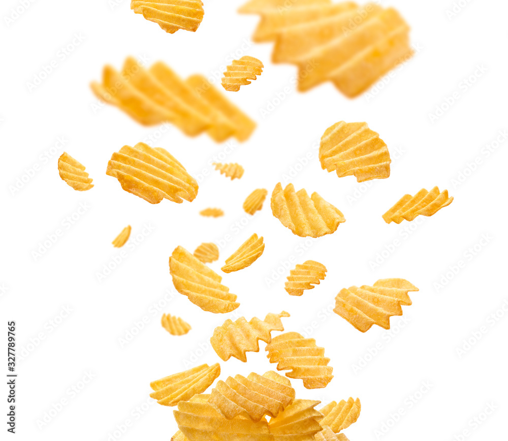 Fluted potato chips levitate on a white background