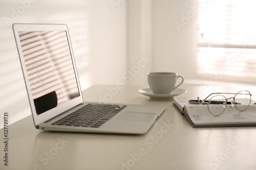 Modern laptop on office table. Stylish workplace