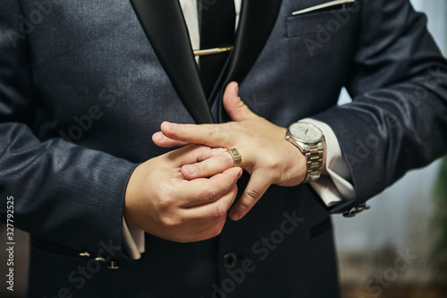 businessman puts a ring on finger