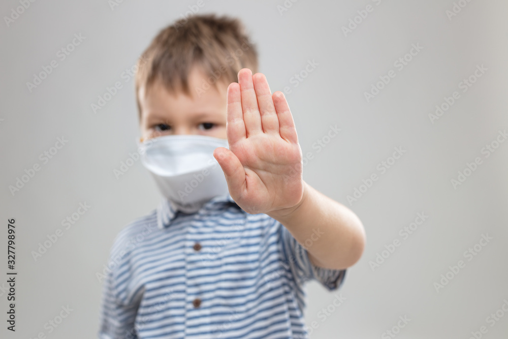 Young child wearing respiratory mask as a prevention against the Coronavirus Covid-19 Young child wearing respiratory mask as a prevention against the Coronavirus Covid-19
