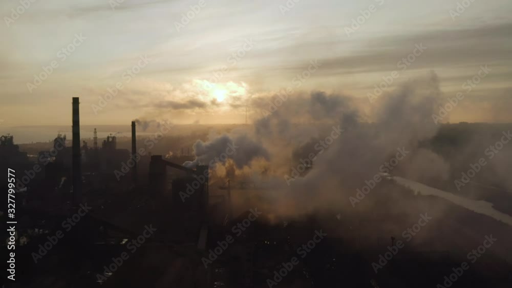 Aerial. GLOBAL WARMING. View of high chimney pipes with grey smoke. Aerial. GLOBAL WARMING. View of high chimney pipes with grey smoke.