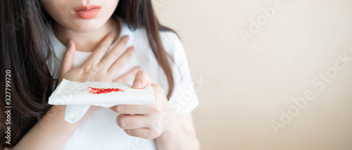Foto Woman have a coughing up blood and chest pain