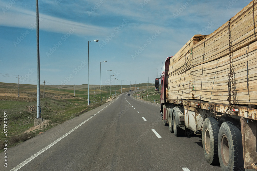 Heavy truck with goods on the motorway, Central Asia, Iran.