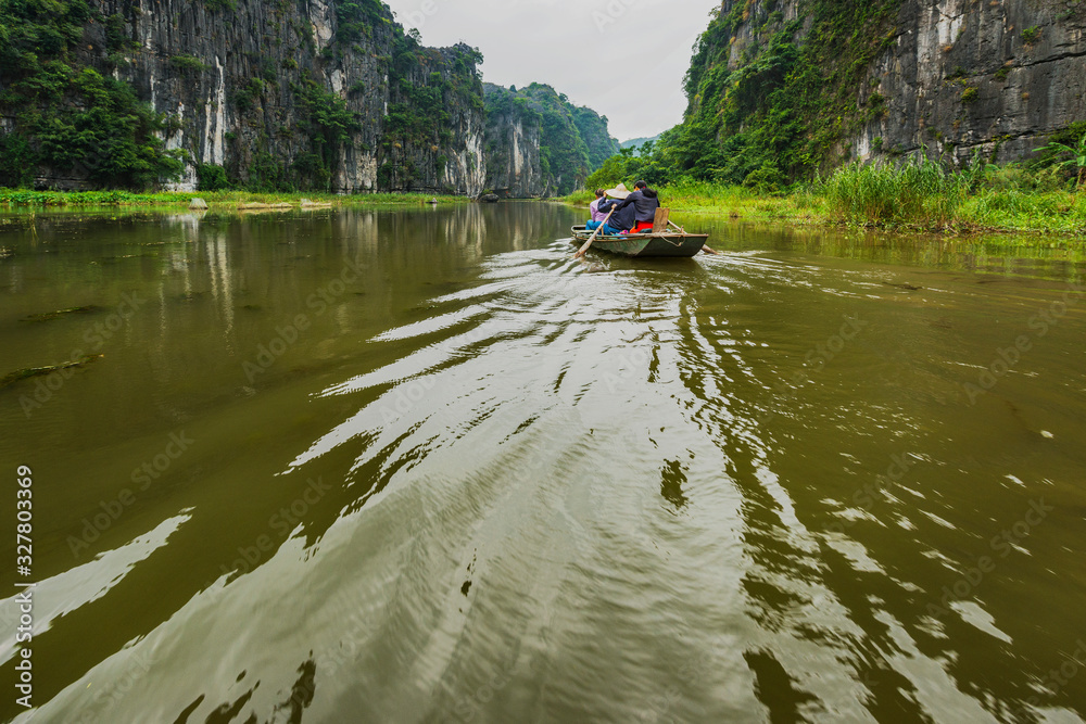 Boat riding tour at Tam Coc river, Ninh Binh, Vietnam. Boat riding tour at Tam Coc river, Ninh Binh, Vietnam.