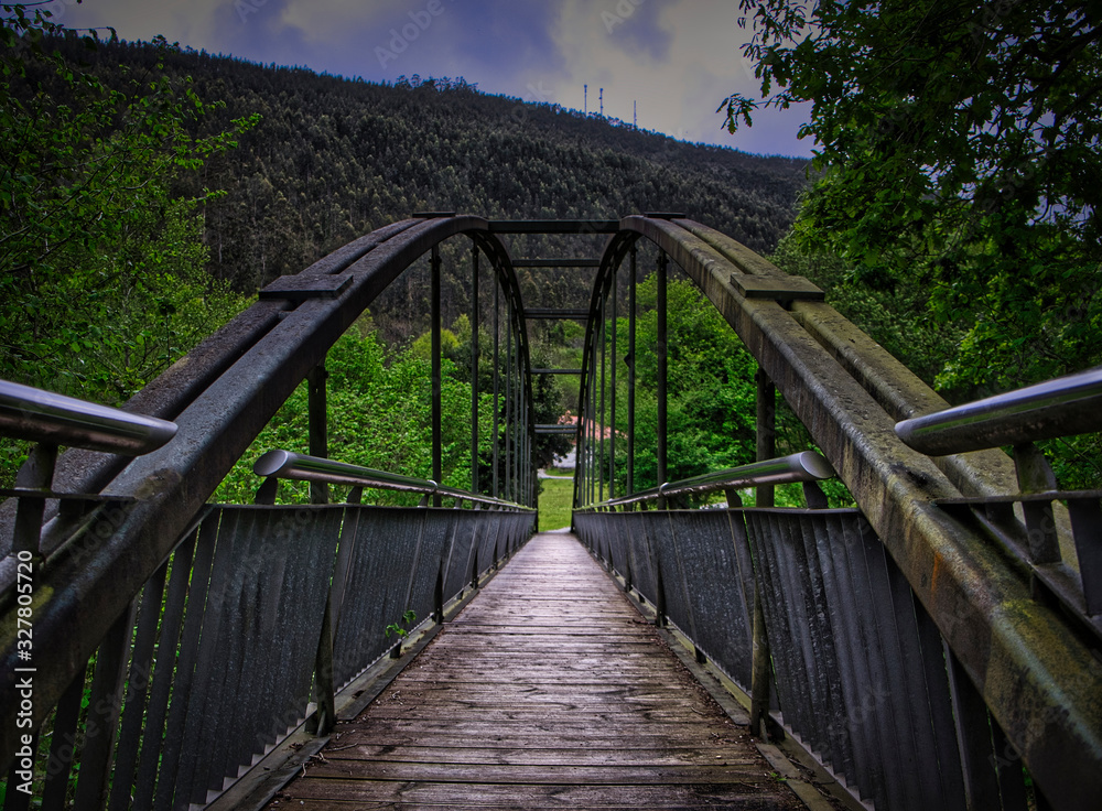 Iron bridge over the train tracks in Cantabria. Spain. Iron bridge over the train tracks in Cantabria. Spain.