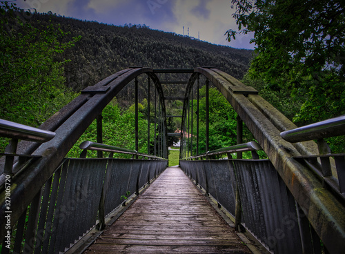 Iron bridge over the train tracks in Cantabria. Spain.