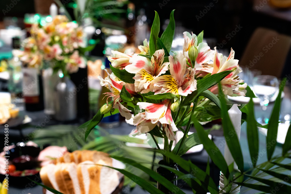 Fototapeta premium bouquet of Orchid flowers on the holiday table.