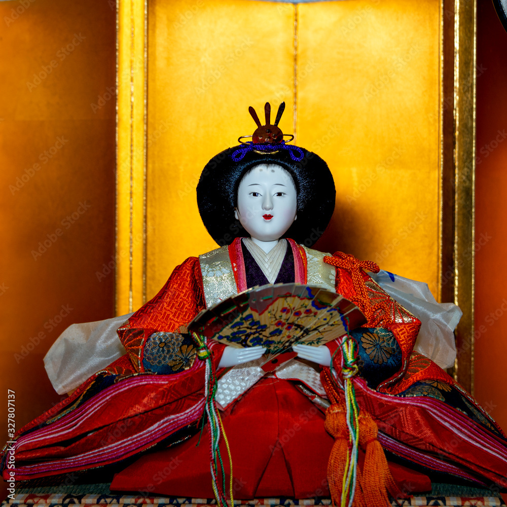 An old and traditional doll representing the empress to celebrate the Girls' Festival in Japan on March 3 An old and traditional doll representing the empress to celebrate the Girls' Festival in Japan on March 3