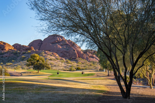 Red rocks surrounding golf fairway photo