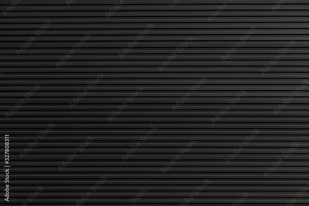 black steel shutter door. grunge black metal foldable door background and texture. black steel shutter door. grunge black metal foldable door background and texture.