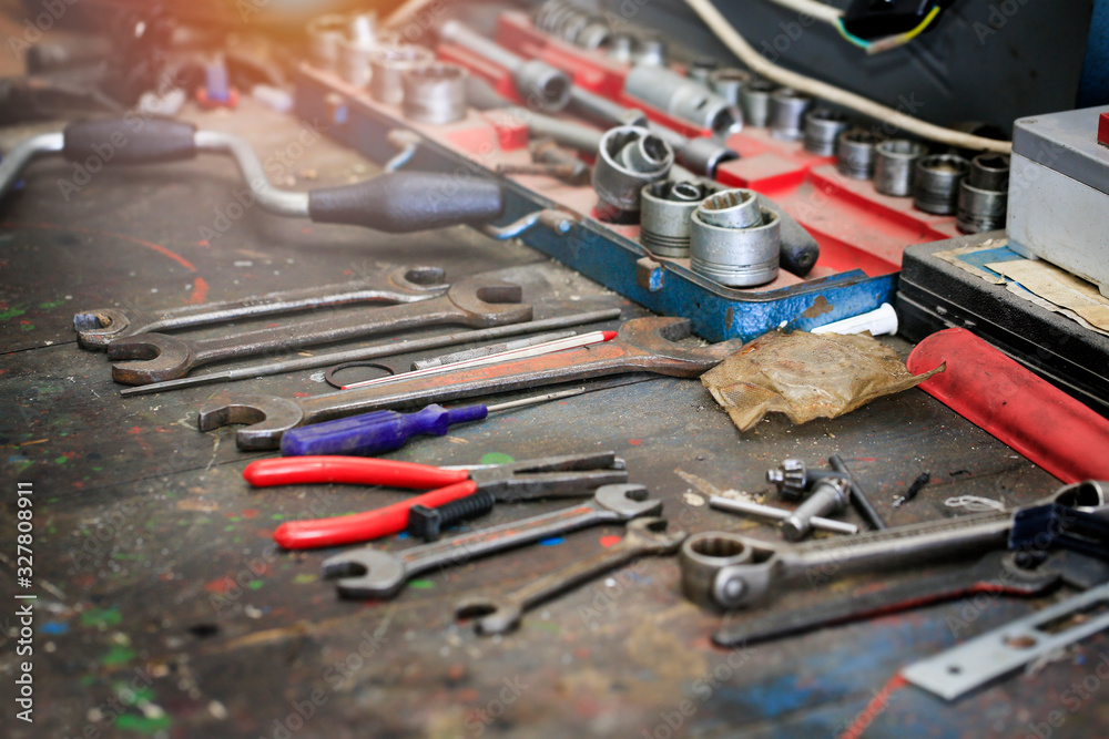 Fototapeta premium Many old tools on the dirty work desk.