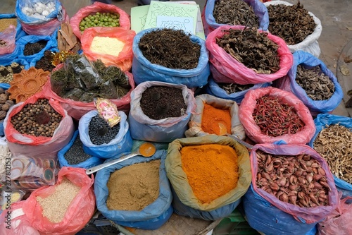Colorful sacks with spices and dried vegetables at a market in Kathmandu, Nepal.