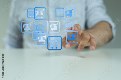 Businessman pressing modern technology panel shopping cart web phone credit card.