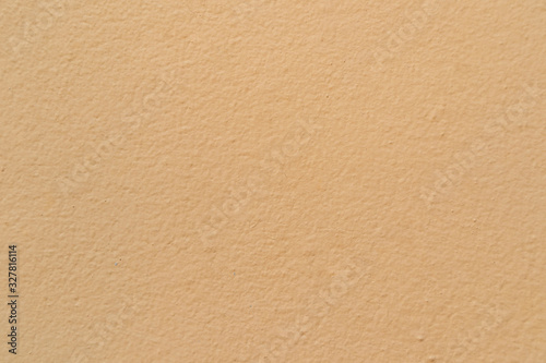 Details of the yellow concrete wall texture for background.