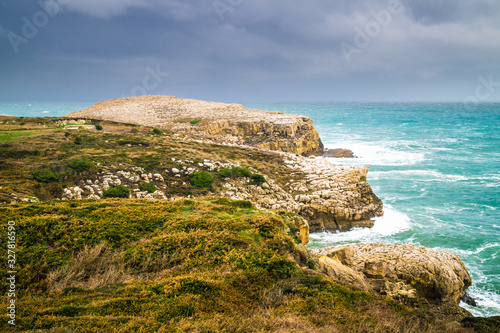 Suances cliffs next to the lighthouse, on stormy day with dramat