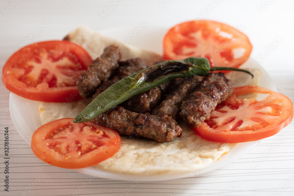 Turkish Style Grill meatball Kofte serving with lavas taco bread Turkish Style Grill meatball Kofte serving with lavas taco bread
