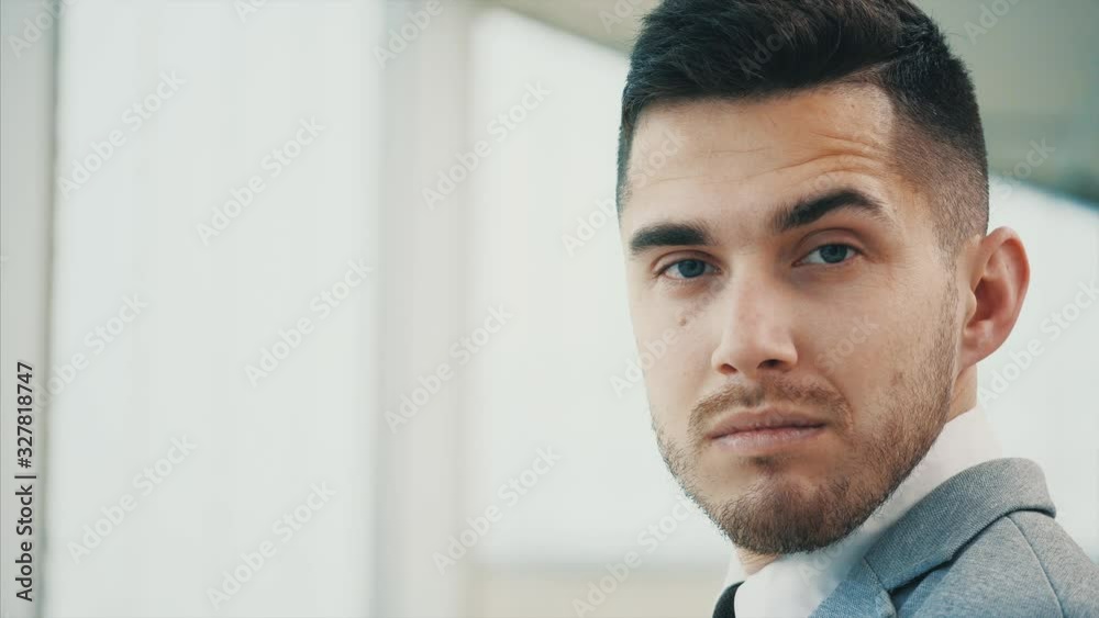 Business man is serious, isolated on white panoramic background. Close up. Copy space. 4K. Business man is serious, isolated on white panoramic background. Close up. Copy space. 4K.