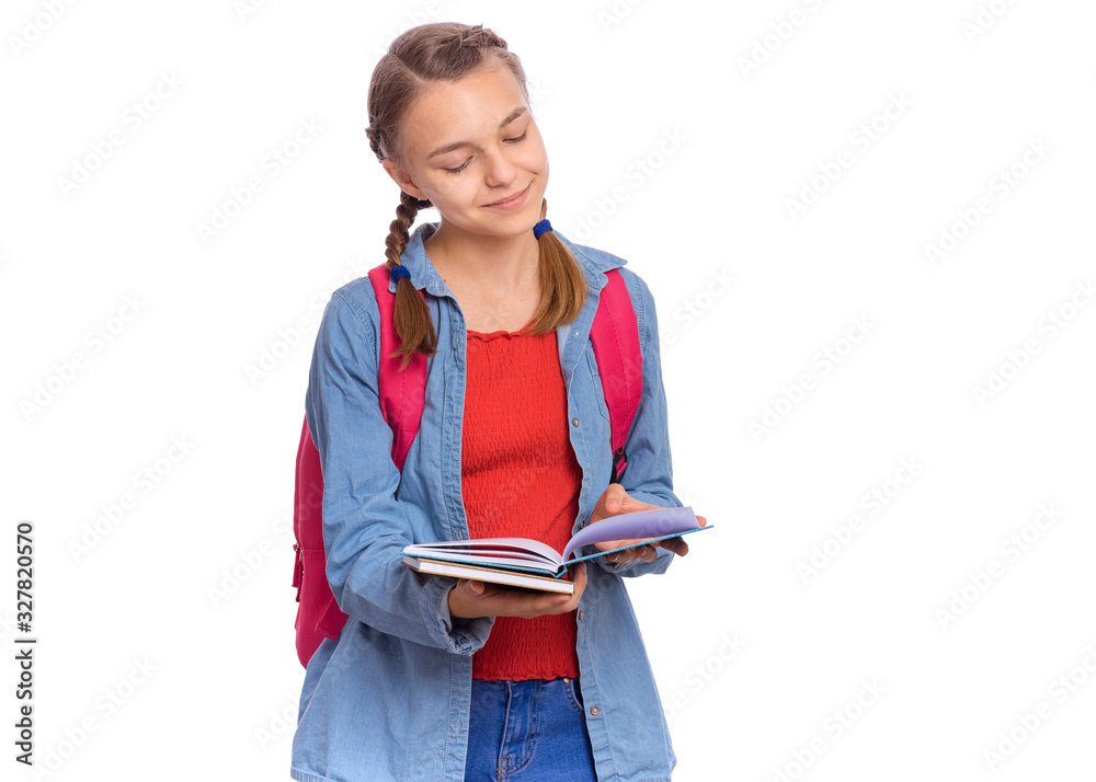 Beautiful student teen girl with backpack reading book. Portrait of cute smiling schoolgirl with bag, isolated on white background. Happy child Back to school. Beautiful student teen girl with backpack reading book. Portrait of cute smiling schoolgirl with bag, isolated on white background. Happy child Back to school.