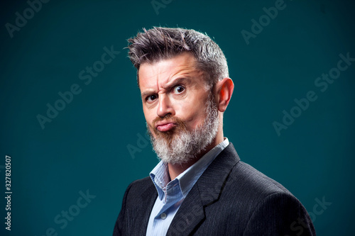 A portrait of bearded serious man. People and emotions concept