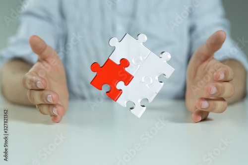 puzzle hand solution concept business. © vegefox.com