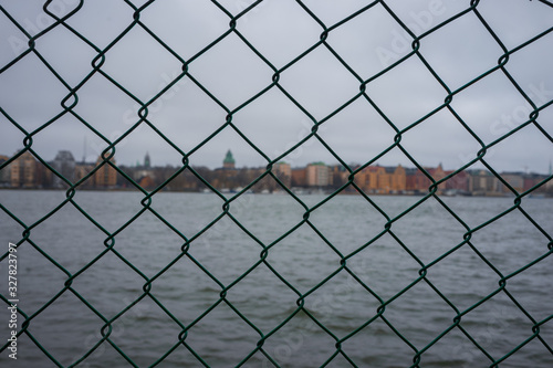Stockholm skyline behind a fence