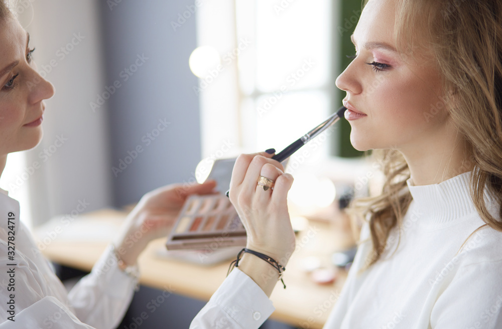 beautiful young model woman getting fashion make-up beautiful young model woman getting fashion make-up
