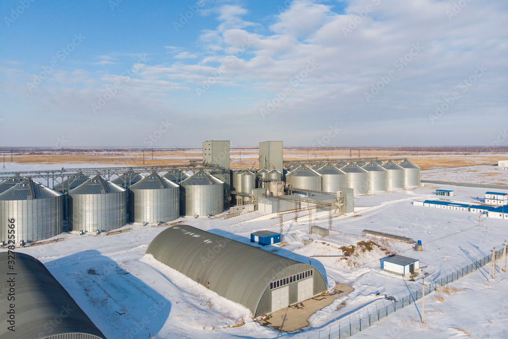 new built cereal elevator photographed from a drone at sunset in the winter new built cereal elevator photographed from a drone at sunset in the winter
