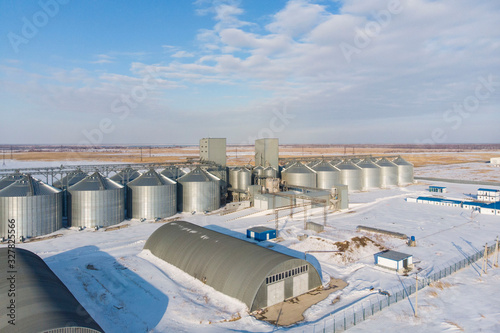 new built cereal elevator photographed from a drone at sunset in the winter