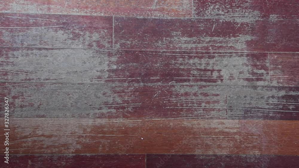 Old scratched hardwood flooring in need of maintenance. Parquet ruined by scratches made by prolonged use of chair needing repair. View from above with zoom in camera movement Old scratched hardwood flooring in need of maintenance. Parquet ruined by scratches made by prolonged use of chair needing repair. View from above with zoom in camera movement