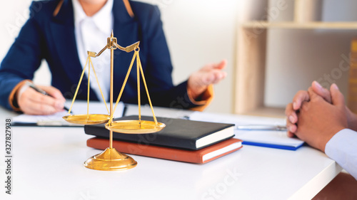 Women lawyer discussing with clients in courtroom. justice and law ,attorney, court judge, meeting concept photo