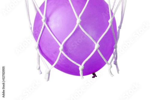 Blue balloon in a basketball net. Accurate throw in the ring.  photo