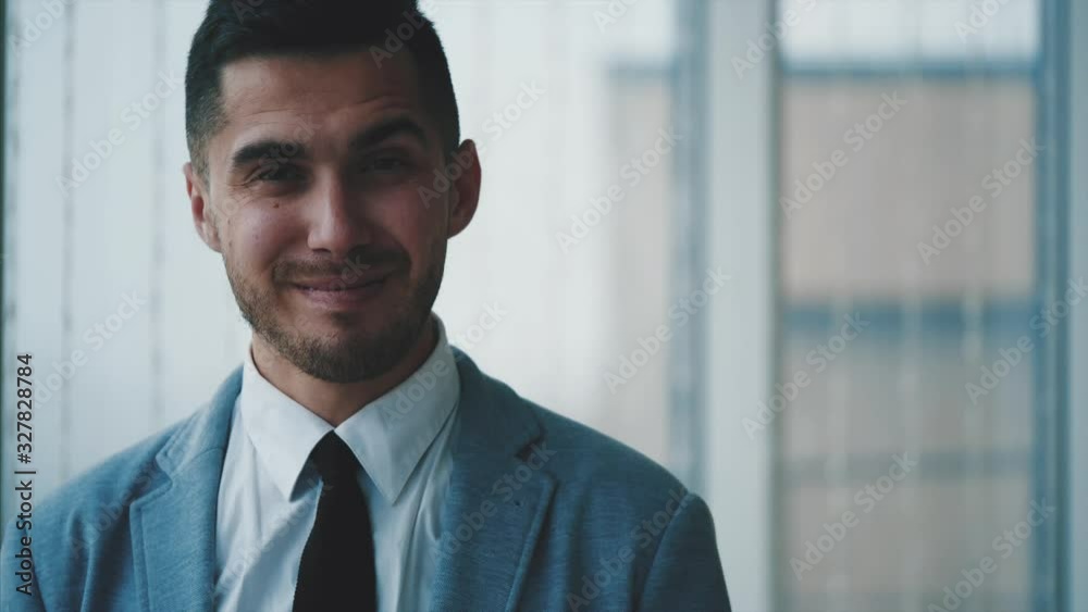 Business man looking aside, then is smiling, isolated on white panoramic background. Close up. Copy space. 4K. Business man looking aside, then is smiling, isolated on white panoramic background. Close up. Copy space. 4K.