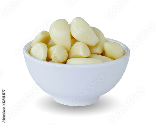 Garlic in a white cup isolated on white background. Thia has clipping path.