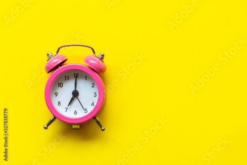 Alarm green vintage alarm clock falling on the floor with color background. Morning and Start up Concept